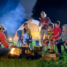 Family enjoying a night camping in South Dakota