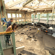 Visitors observing active digging at Mitchell Prehistoric Indian Village in South Dakota